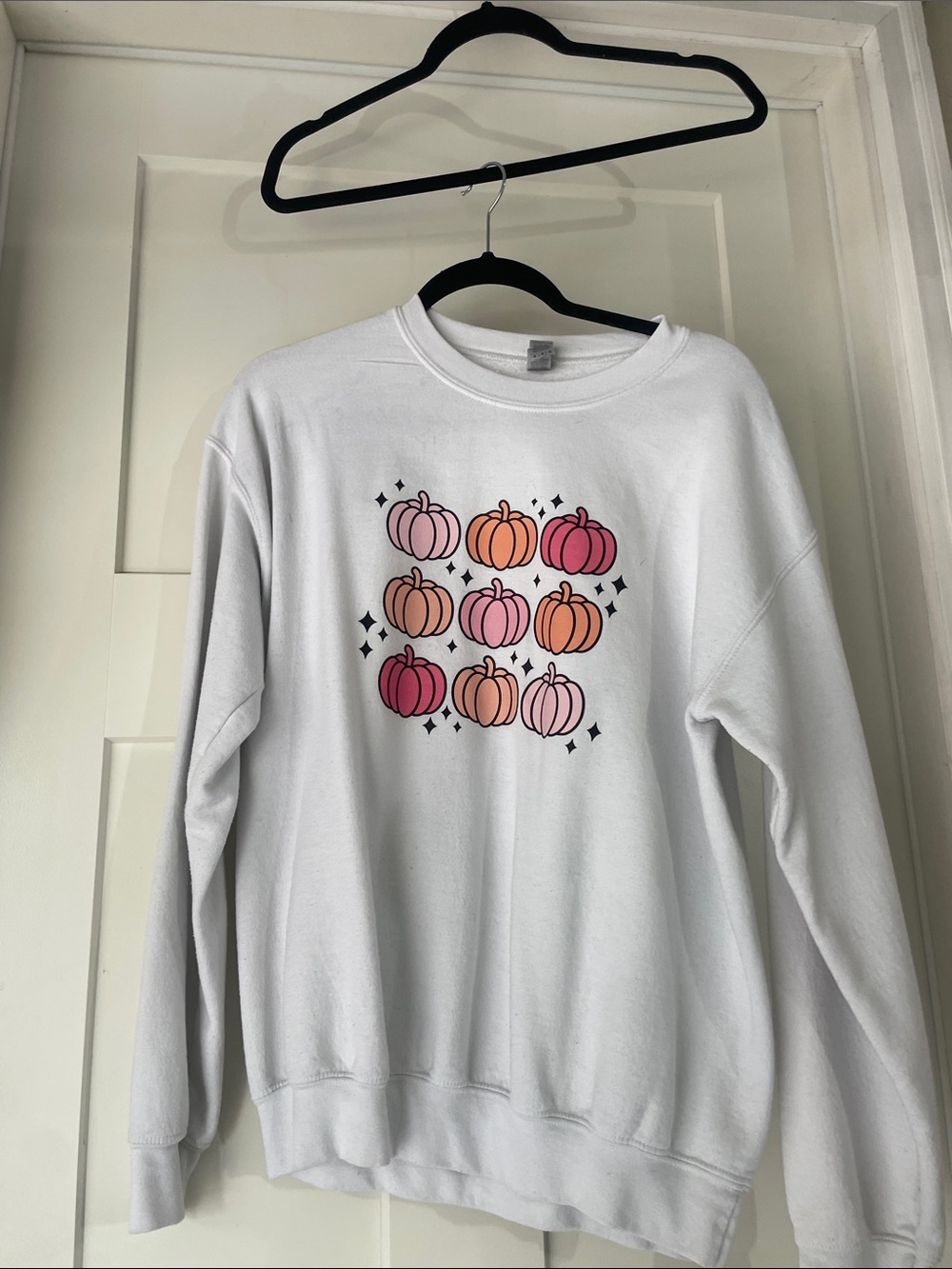 White Women's Crewneck Sweatshirt with Pink & Orange Pumpkin Graphic